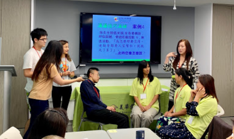 participants in discussion on chairs