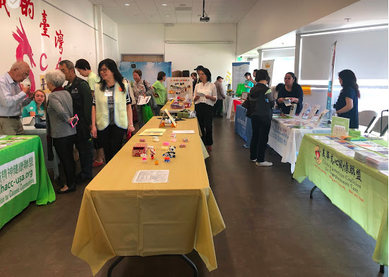 Room of booths at health fair
