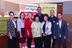 group photo of participants in front of CACCC banner