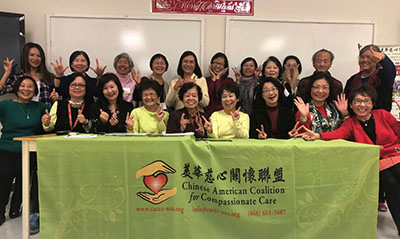 group photo behind CACCC table
