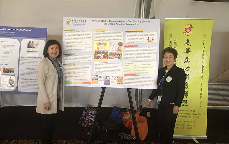CACCC members in front of display board