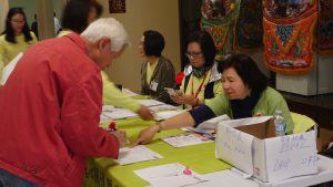 Volunteers at CACCC table at event