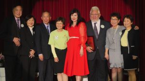 speakers standing on stage at CACCC anniversary event
