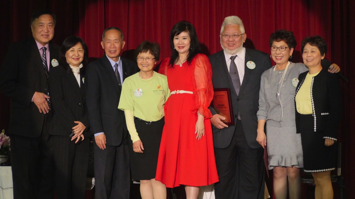 speakers standing on stage at CACCC anniversary event