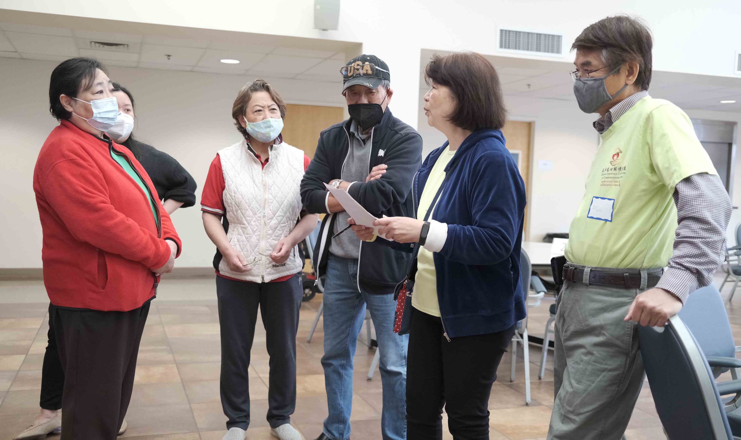 CACCC staff talking with participants at event