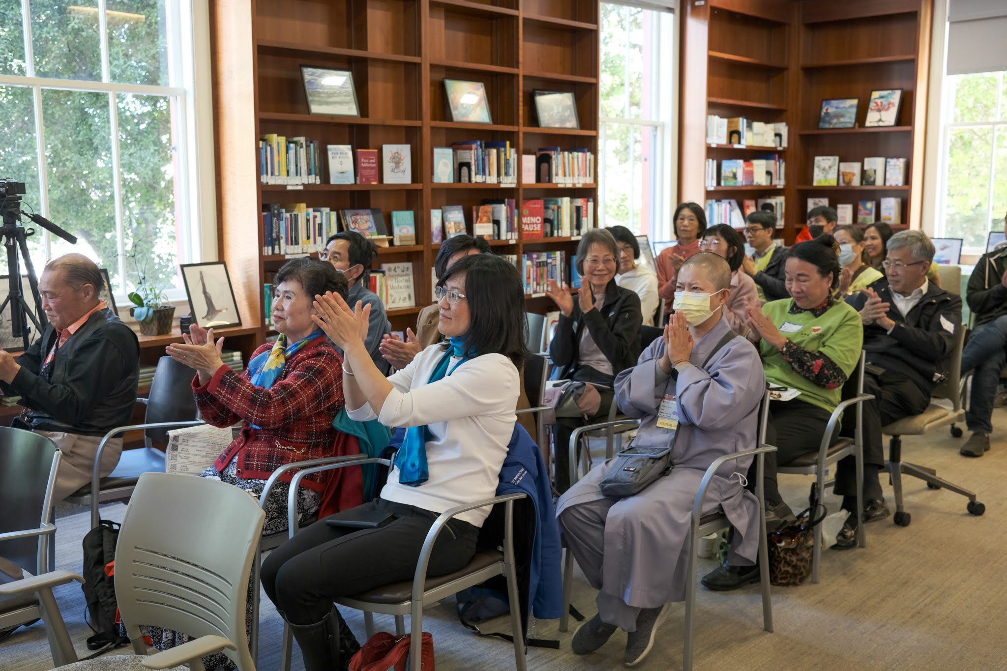 Audience clapping at CACCC event