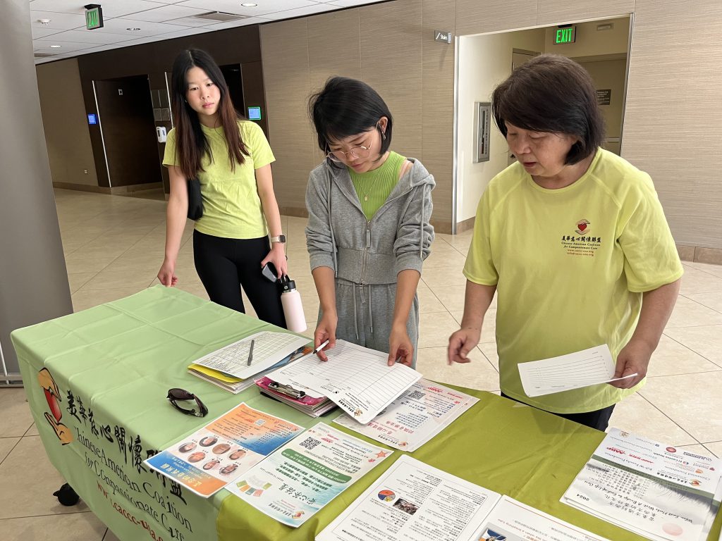 CACCC Volunteers working together to track list of attendees