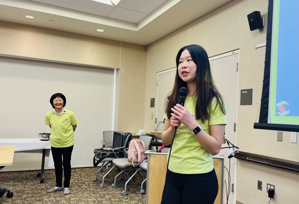 Young volunteer speaking at CACCC event