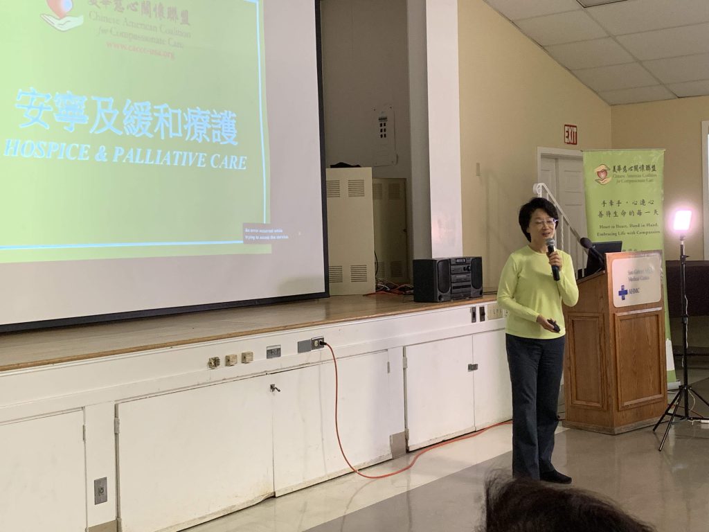 Volunteer speaking about Hospice and Palliative Care at Community Event