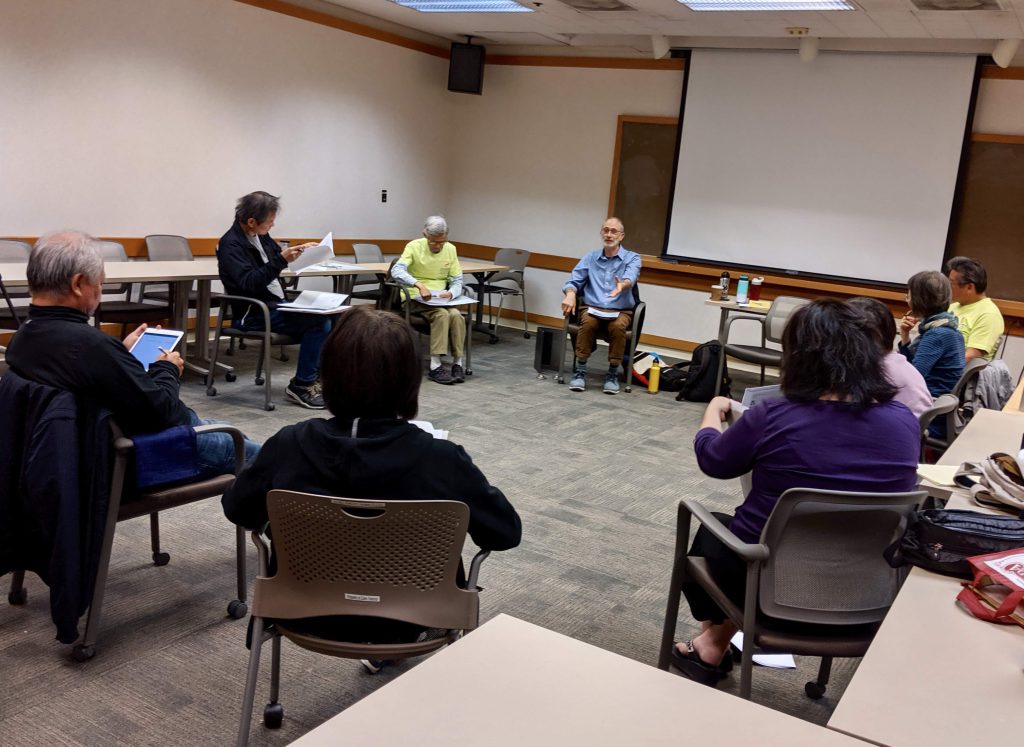 group sitting in a circle discussing