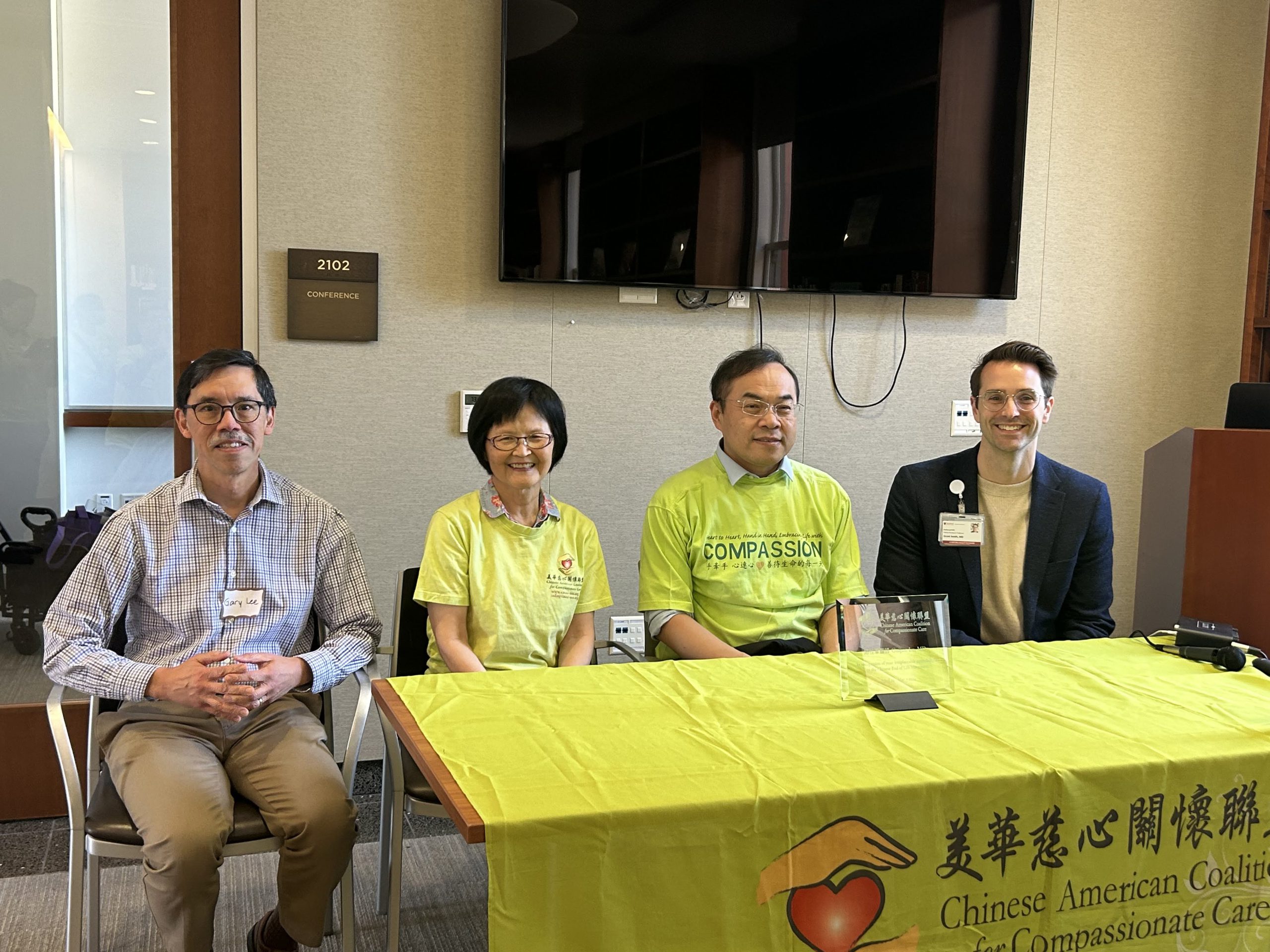 CACCC sitting with guest doctors at event