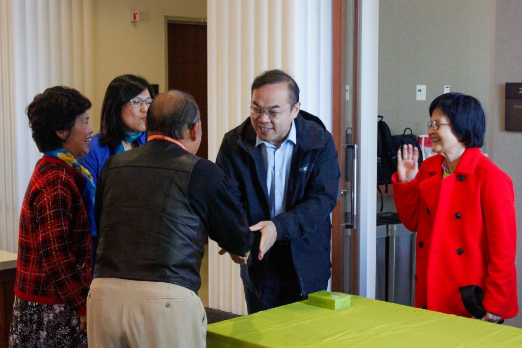 Shaking hands with guest speaker