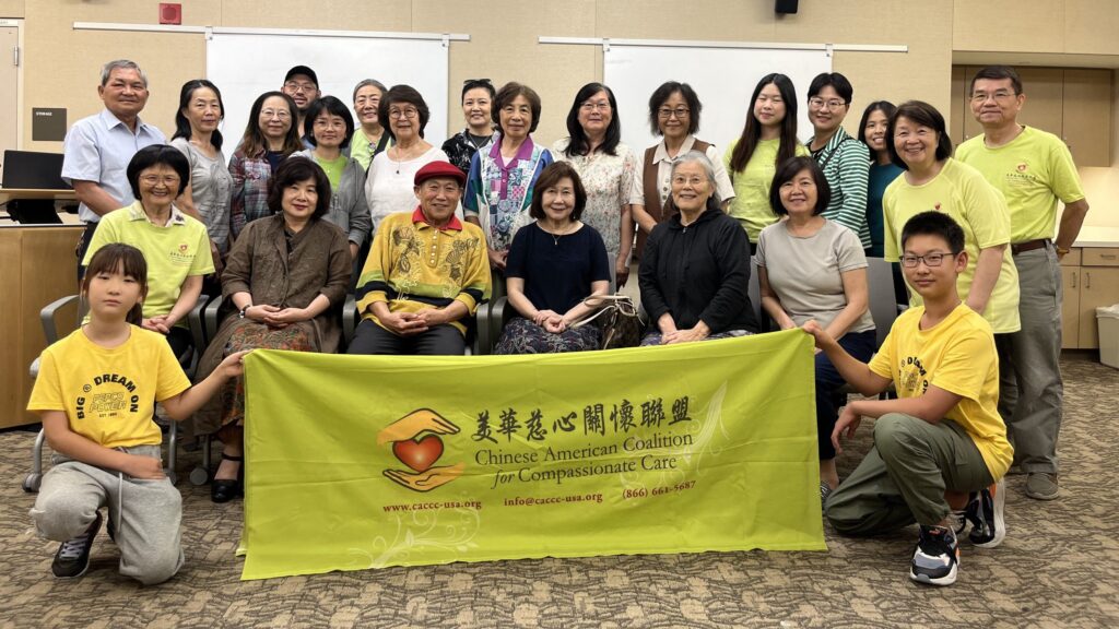 CACCC volunteers and participants holding up CACCC banner at event