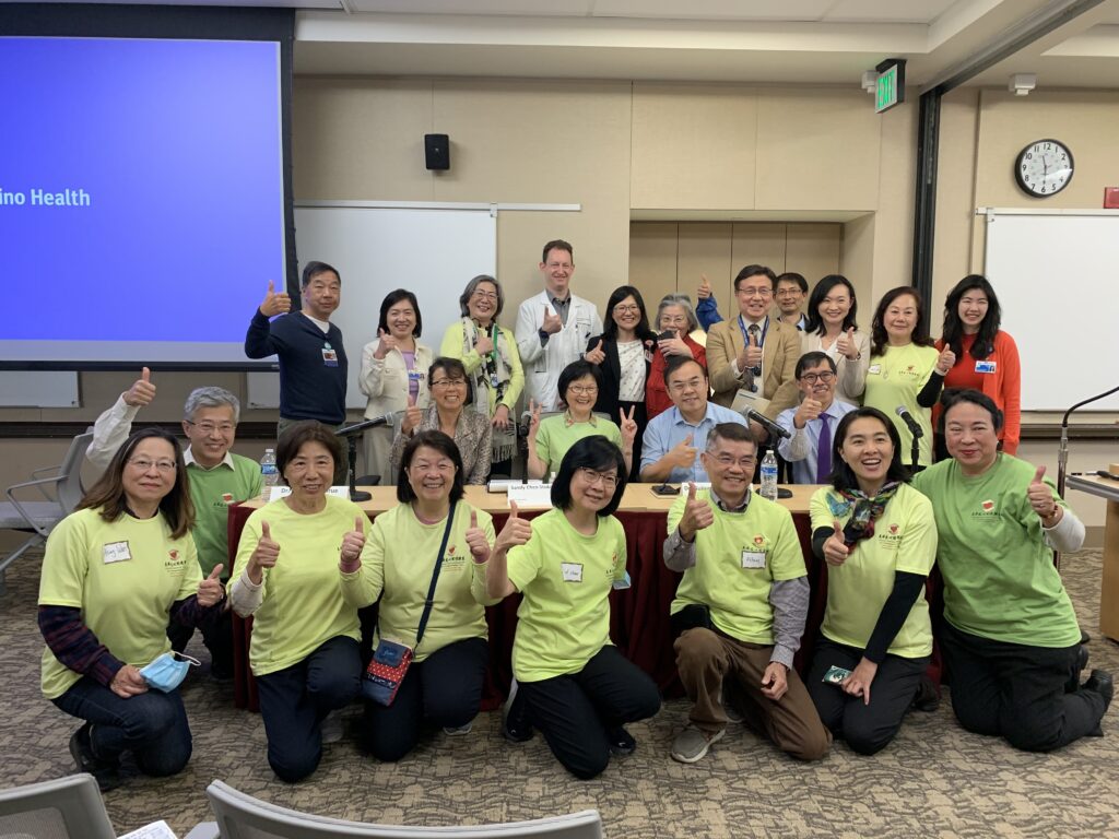 group of volunteers showing up thumbs up to camera