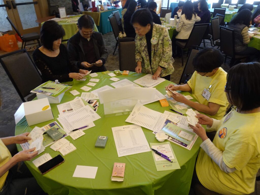 participants with forms at CACCC event