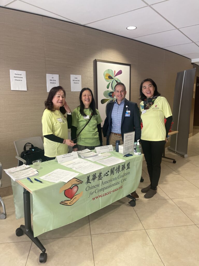 CACCC volunteers in front of table with information
